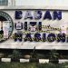 MBG Watch memasang garis kuning-hitam atau menyegel secara simbolis area depan kantor BGN